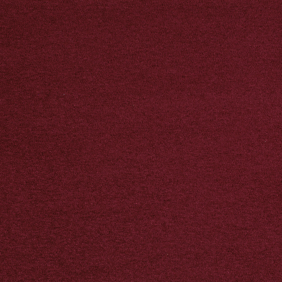 Close-up of maroon fabric with a soft, fuzzy texture.