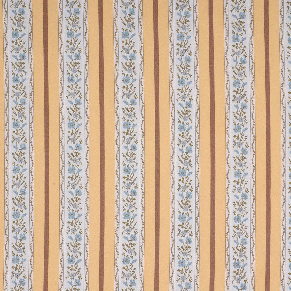 Vintage striped upholstery fabric with warm tan and brown vertical bands and a pale blue floral stripe.