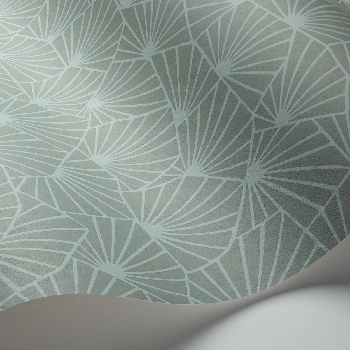Mint teal wallpaper with white palm-leaf fan pattern, subtle texture, peeling corner hinting at roll.