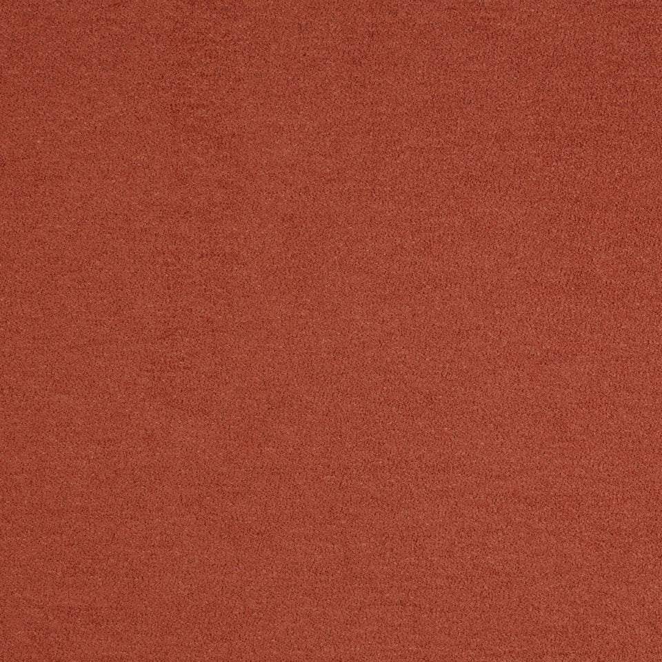 Terracotta orange upholstery fabric swatch with a subtle weave texture.