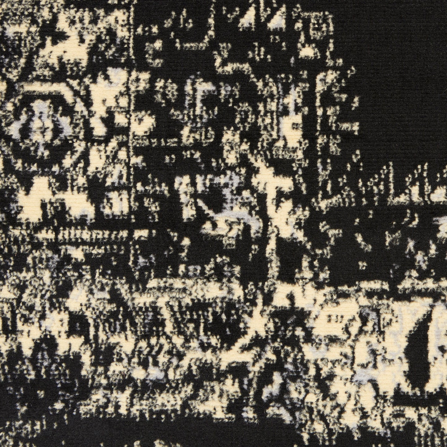Black and cream distressed abstract rug pattern with a woven texture, modern vintage style.