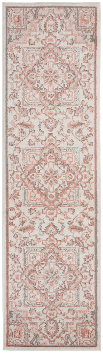 Soft pink and ivory Persian-style rug runner with ornate medallions and floral borders