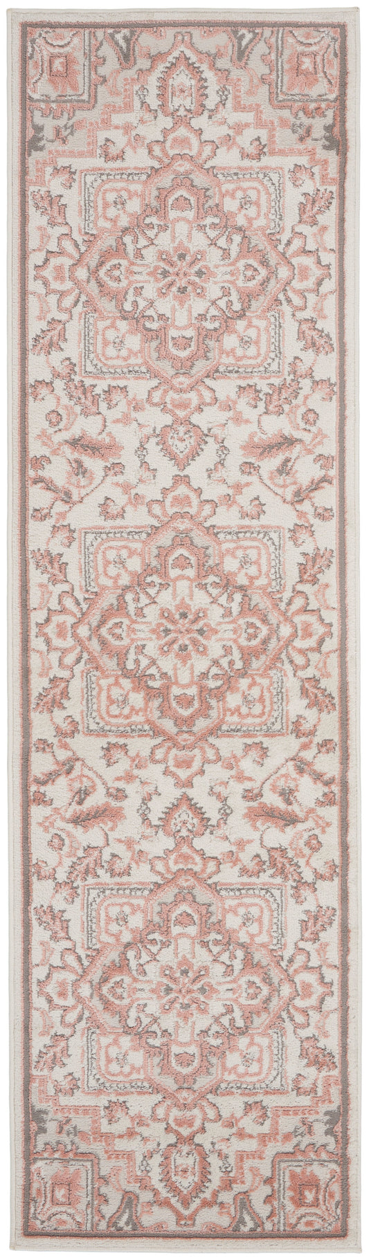 Soft pink and ivory Persian-style rug runner with ornate medallions and floral borders
