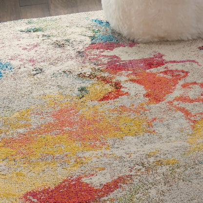 Vibrant abstract shag area rug with yellow, pink, orange and blue patches on cream base; soft, cozy living room decor.