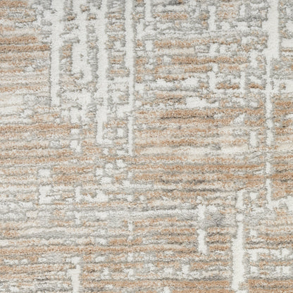 Beige and ivory geometric patterned area rug with a distressed woven texture.