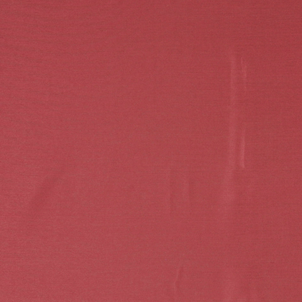 Solid raspberry upholstery fabric with a subtle weave and gentle creases.