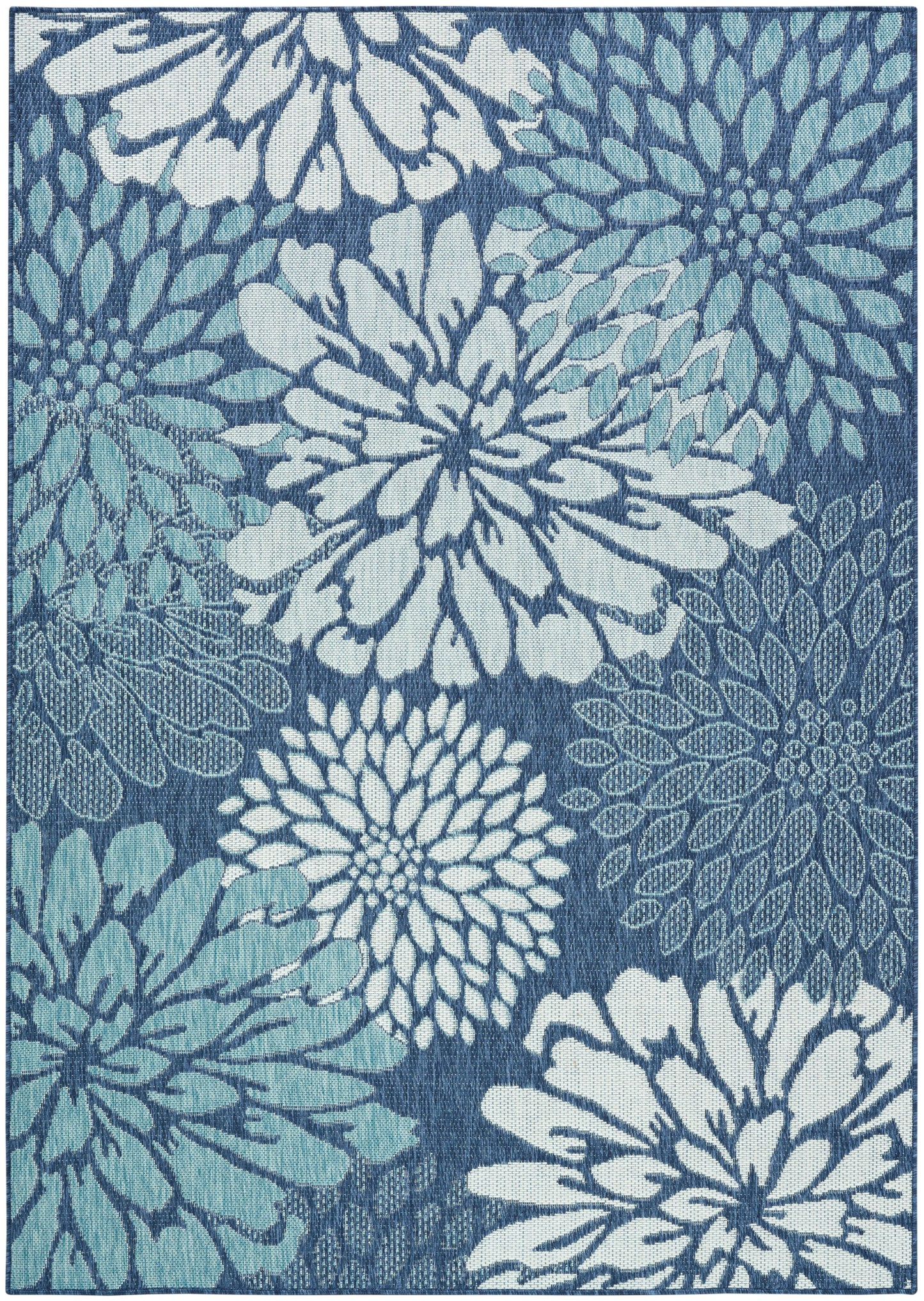Blue floral rug with large chrysanthemum-like blossoms in white and light blue on a dark blue background.
