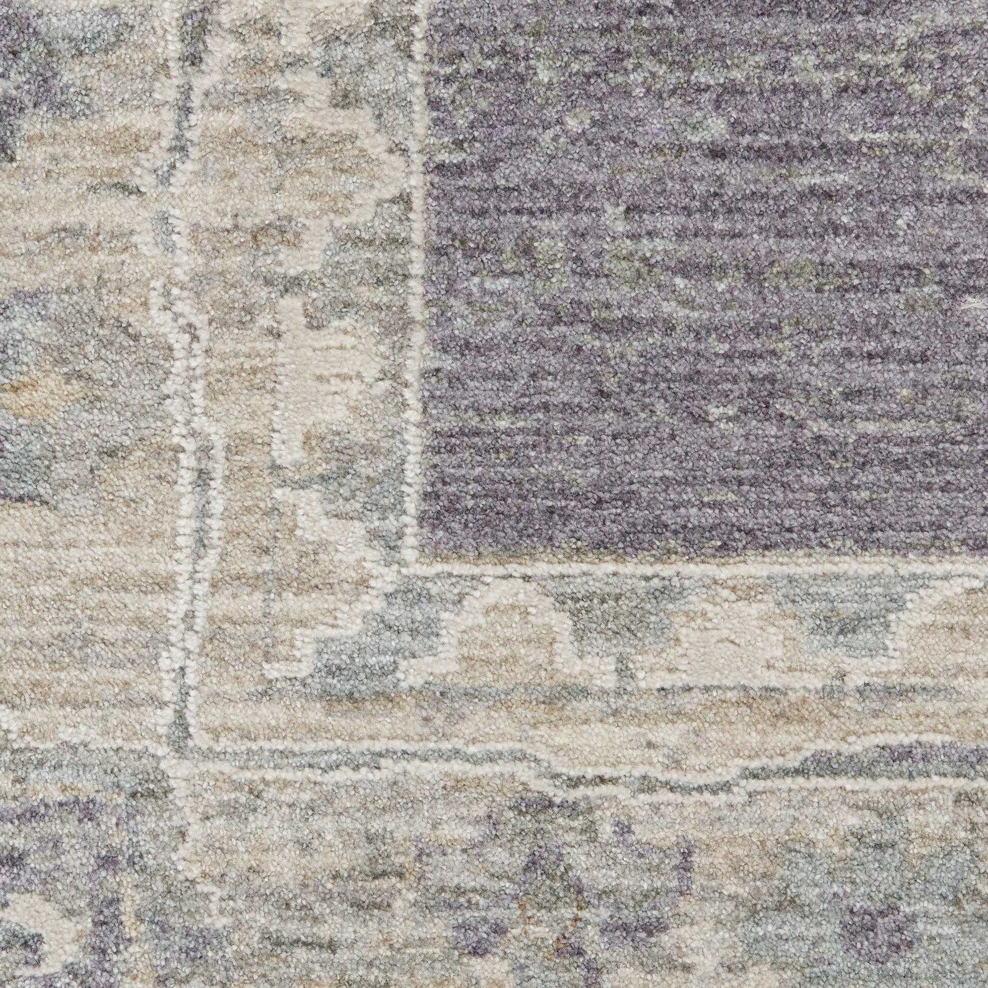 Muted lavender and gray distressed runner rug with a beige border detailing, 10 ft long.
