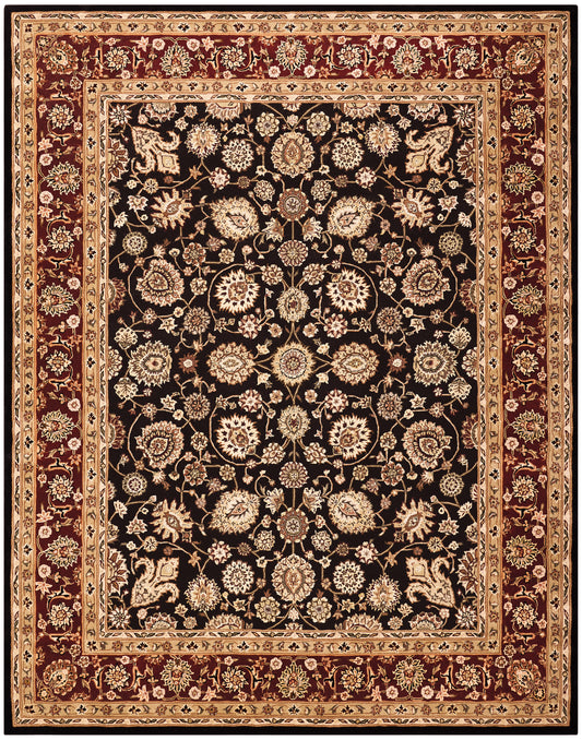 Black field oriental rug with cream-gold floral motifs and burgundy-beige borders.