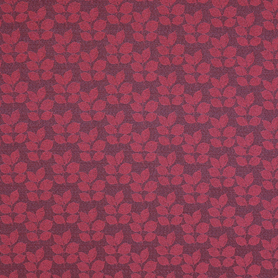 Red floral leaf pattern on deep burgundy fabric; woven textile with repeating small blossoms.