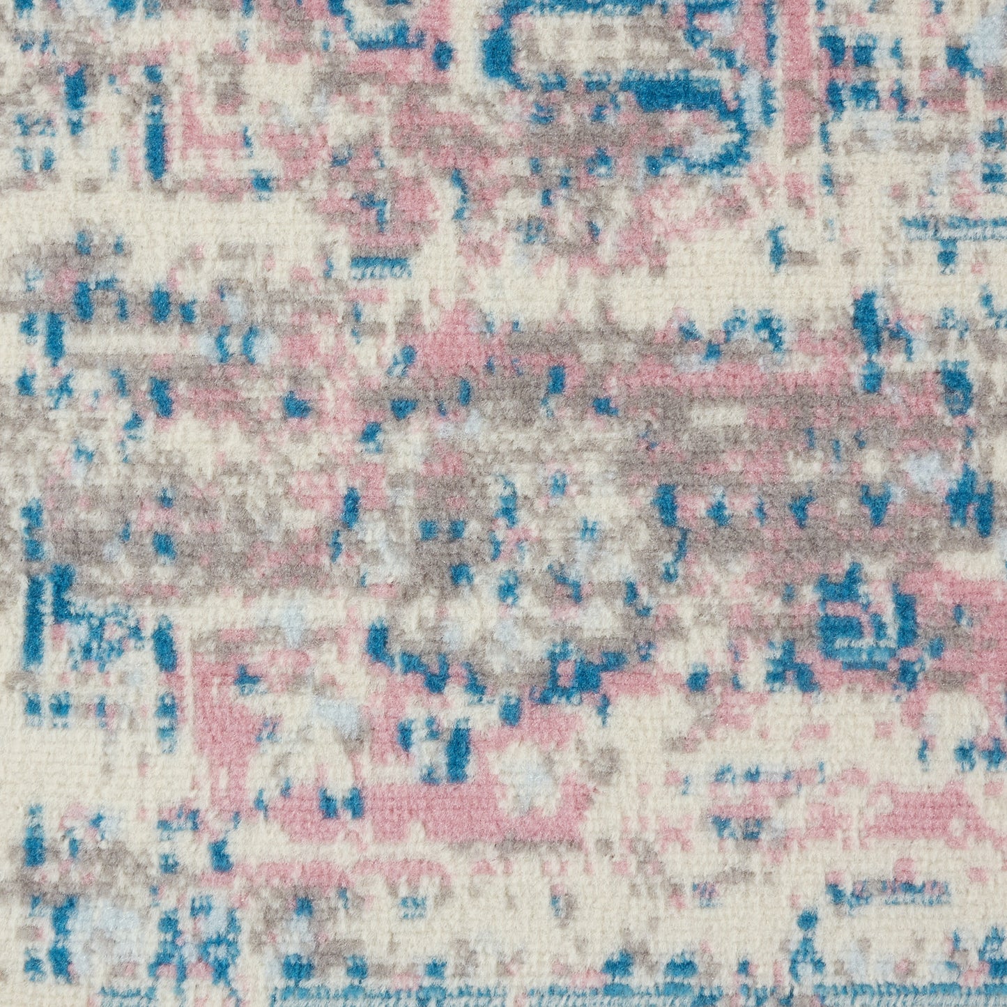 Pastel abstract area rug with pink, blue and beige tones; distressed vintage pattern and soft textured surface.