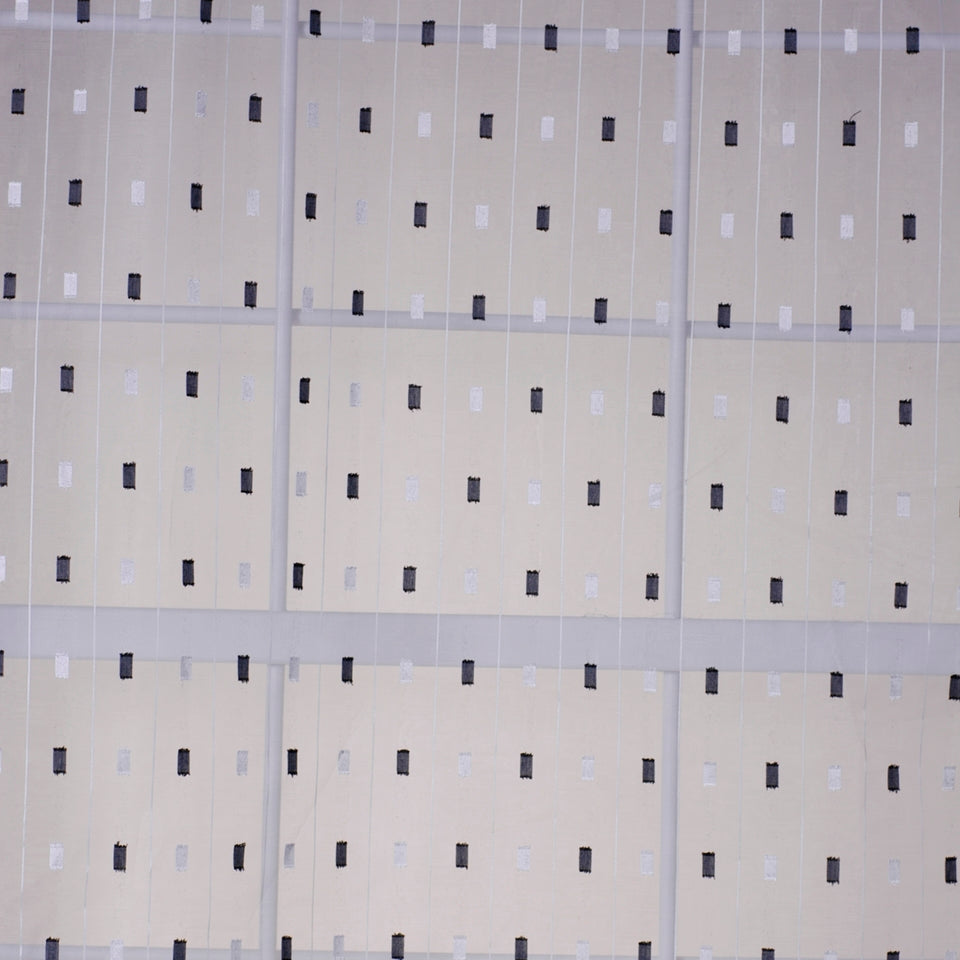 Beige zebra print drapery fabric with black stripes.