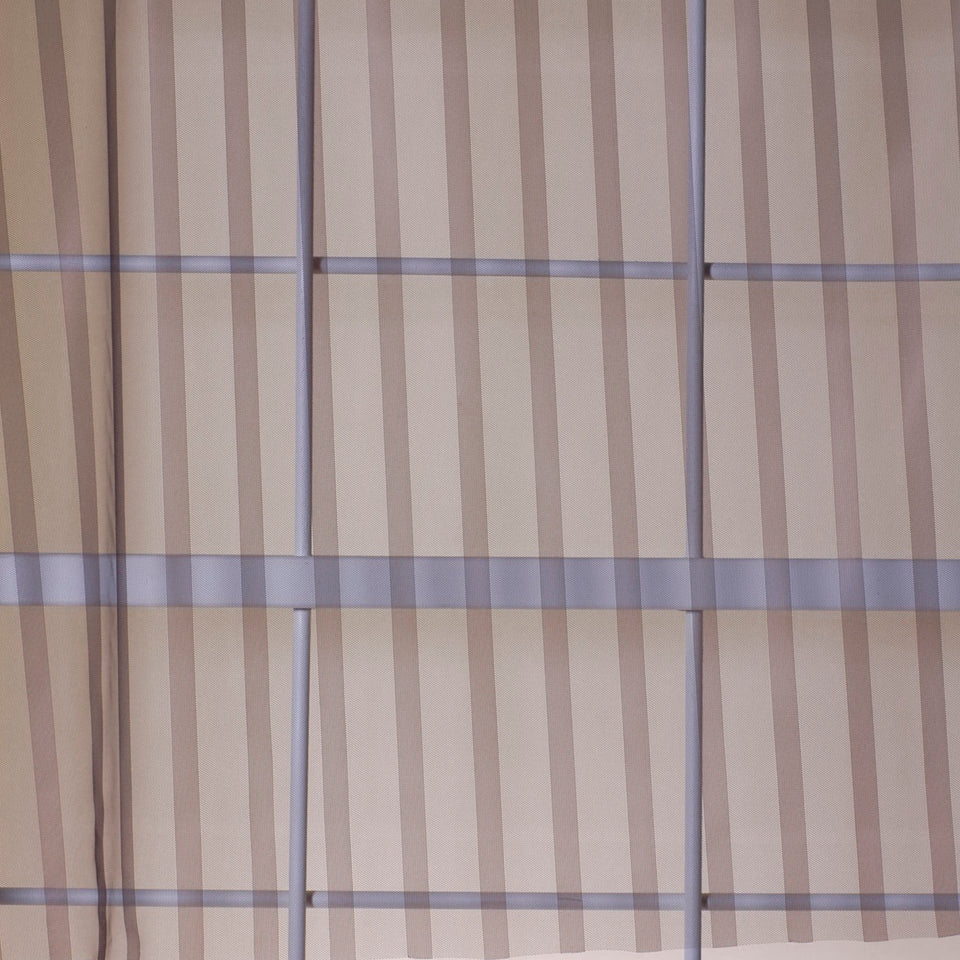 Beige striped net drapery fabric.