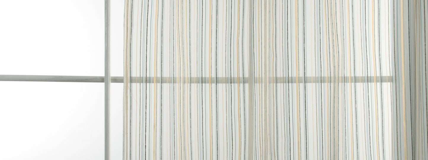 Striped sheer curtain in pale blue, beige, and white hanging from a metal rod beside a window.
