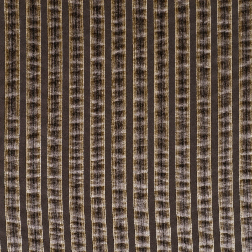 Close-up of brown & black vertical striped fabric with a ribbed, mottled texture.