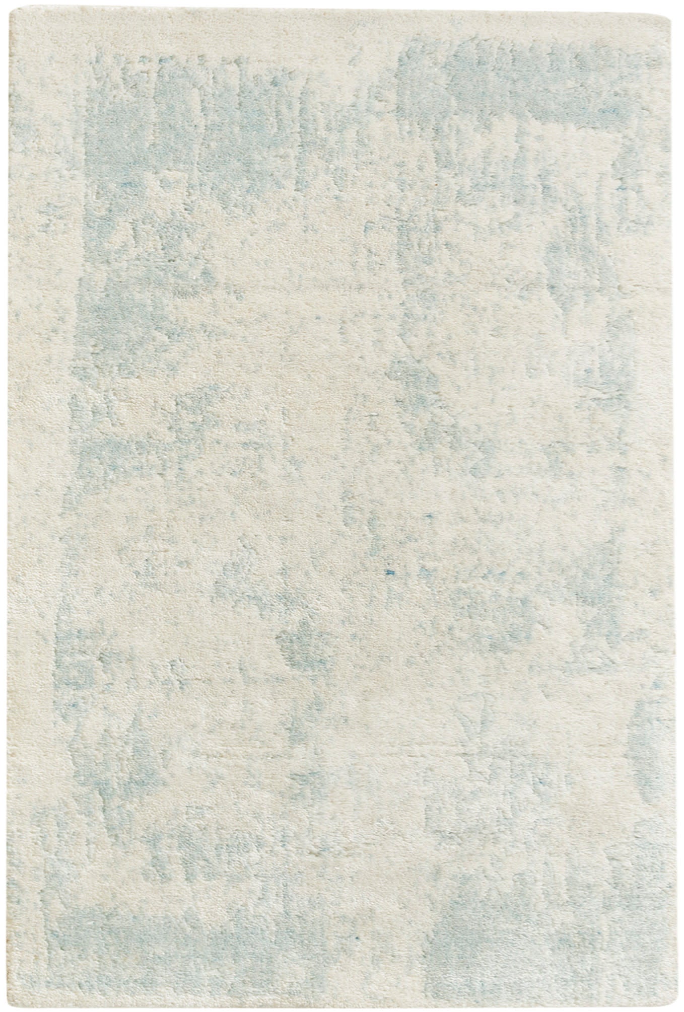 Rectangular area rug in cream with a pale blue abstract pattern and plush, soft pile.