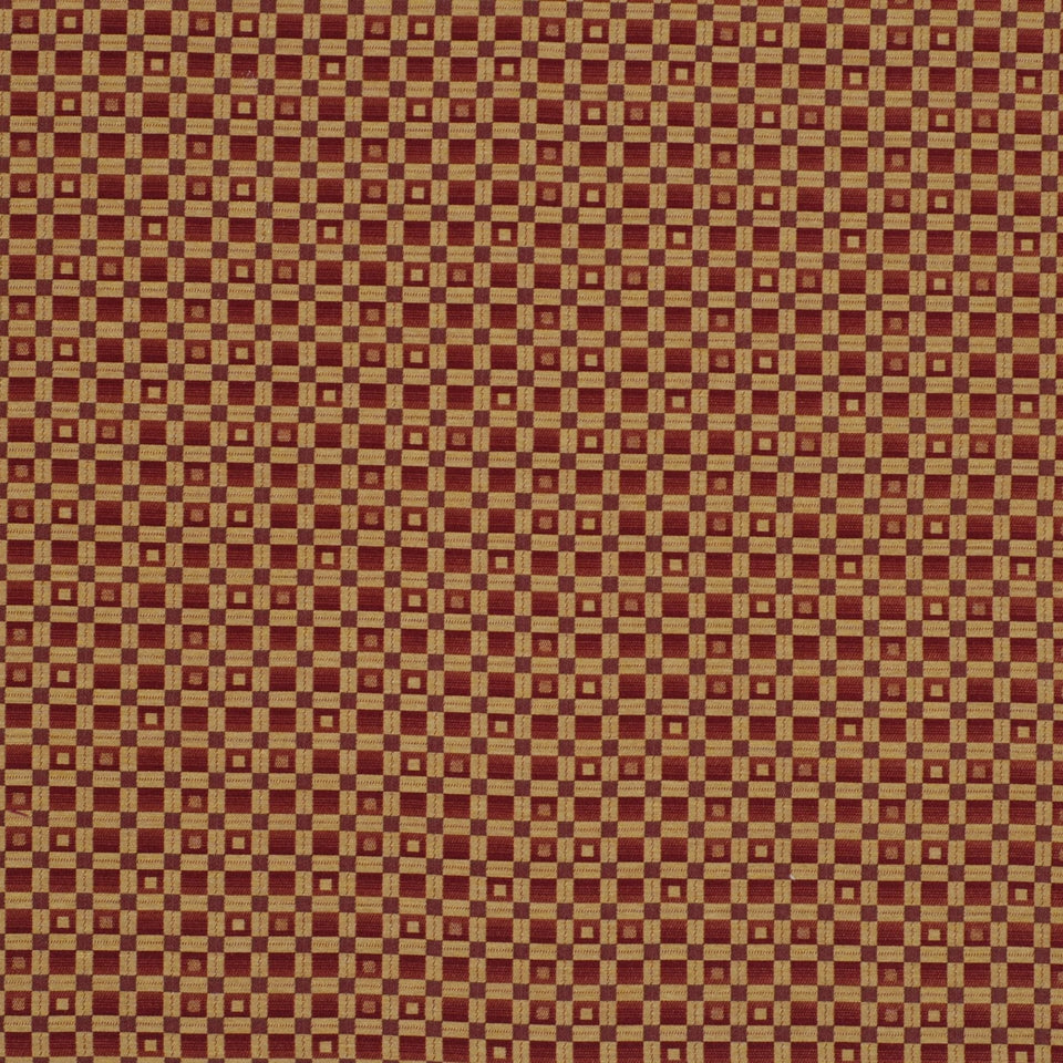 Gold and burgundy woven fabric with tiny checker squares; vintage upholstery or drapery textile.