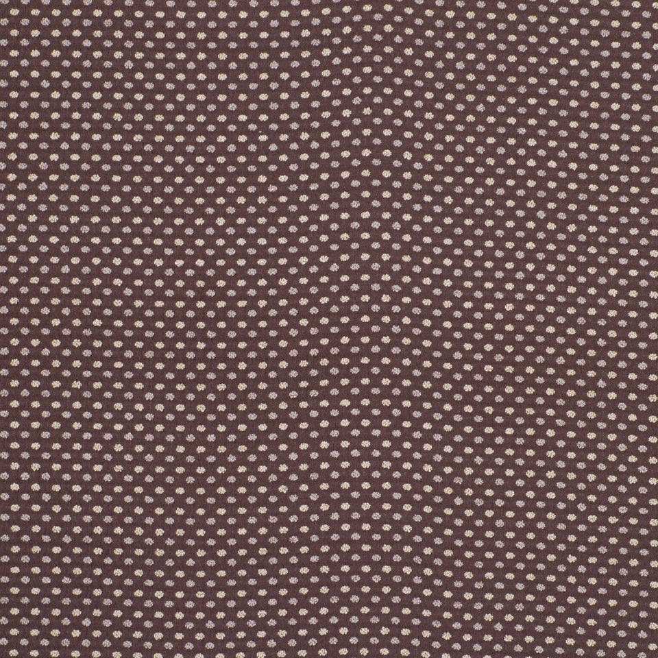 Brown boucle upholstery fabric with tiny white polka dots; textured textile.