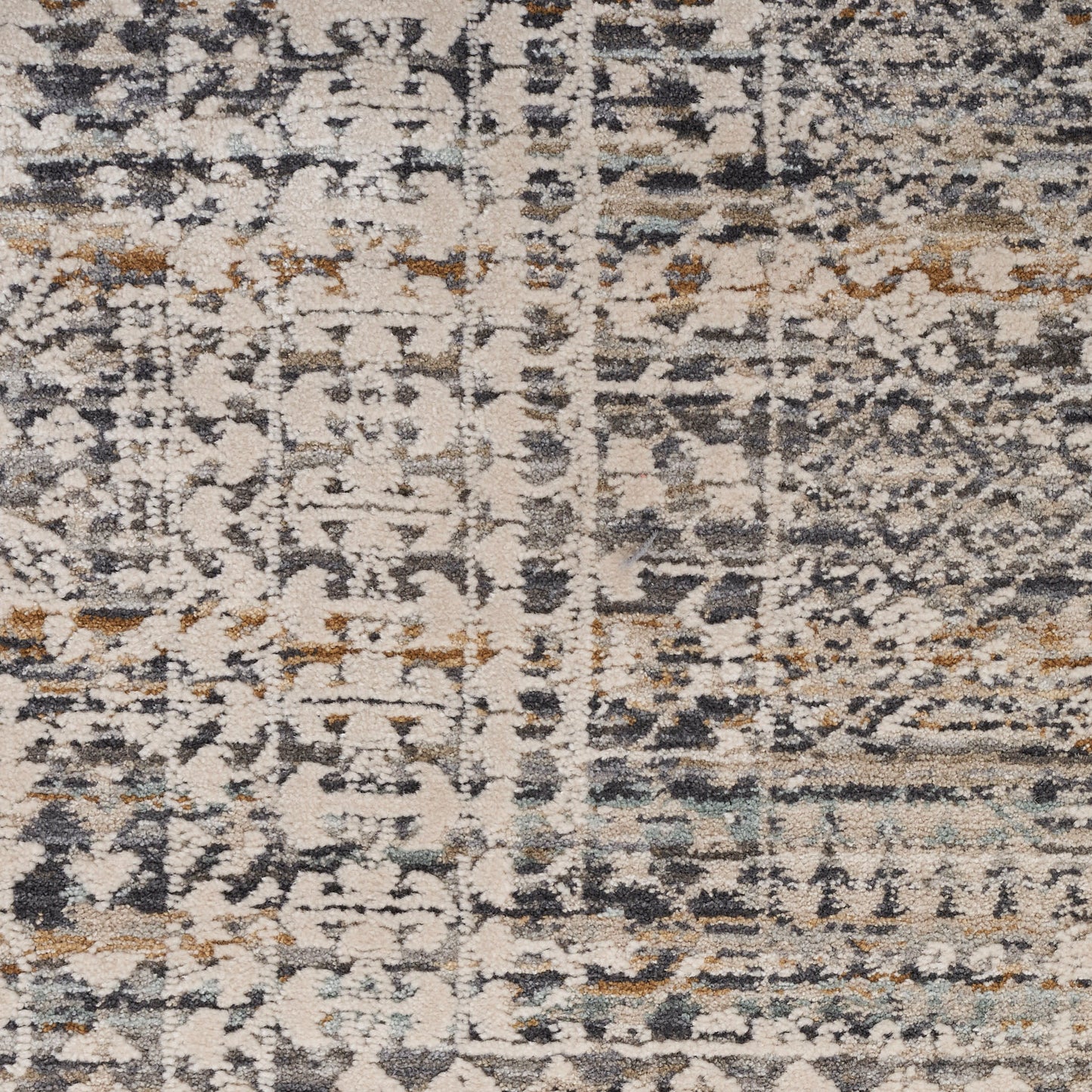 Rectangular rug with distressed abstract pattern in cream, gray, navy and tan; vintage-inspired, soft plush pile.