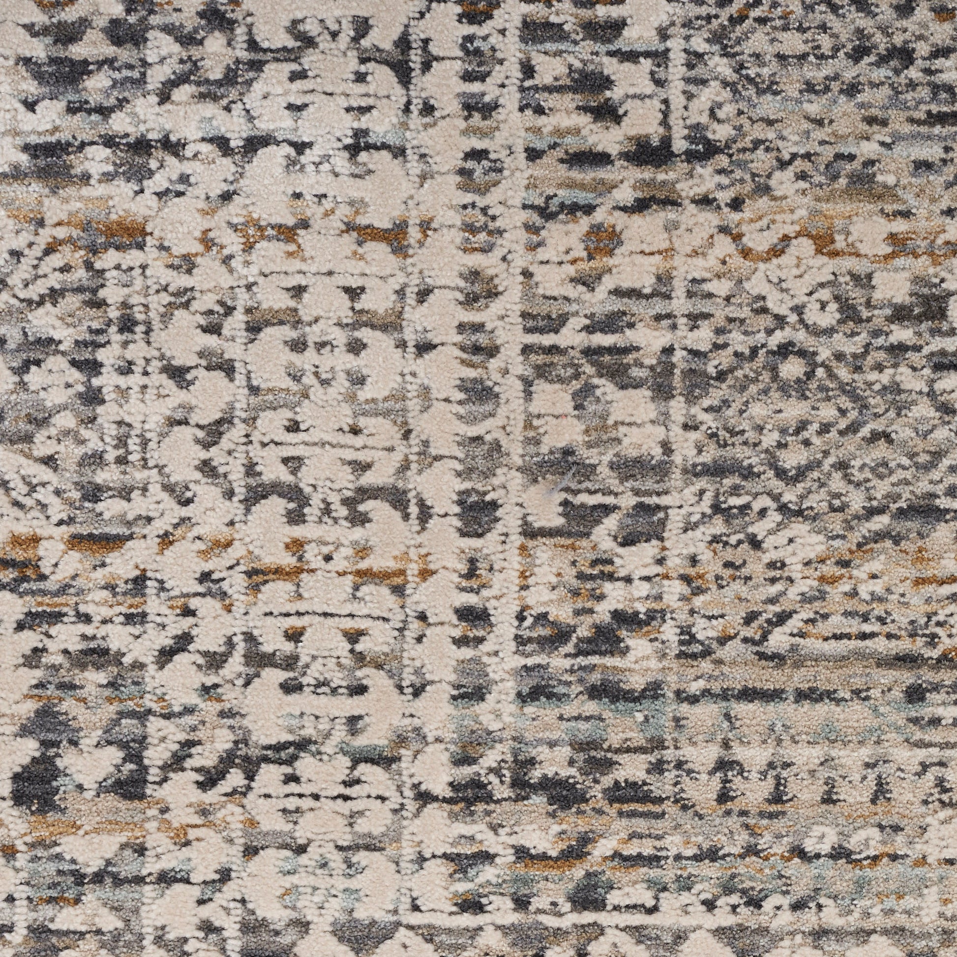 Rectangular rug with distressed abstract pattern in cream, gray, navy and tan; vintage-inspired, soft plush pile.