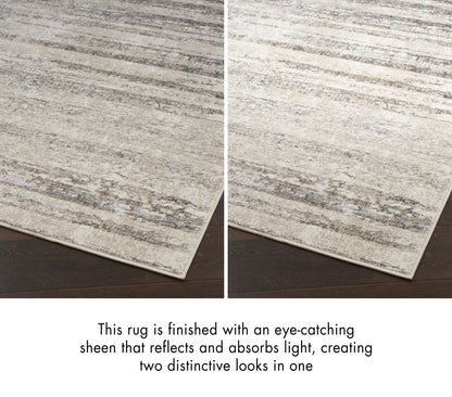 Rectangular beige rug with subtle gray streaks and a reflective sheen, creating two distinct looks on dark wood flooring.