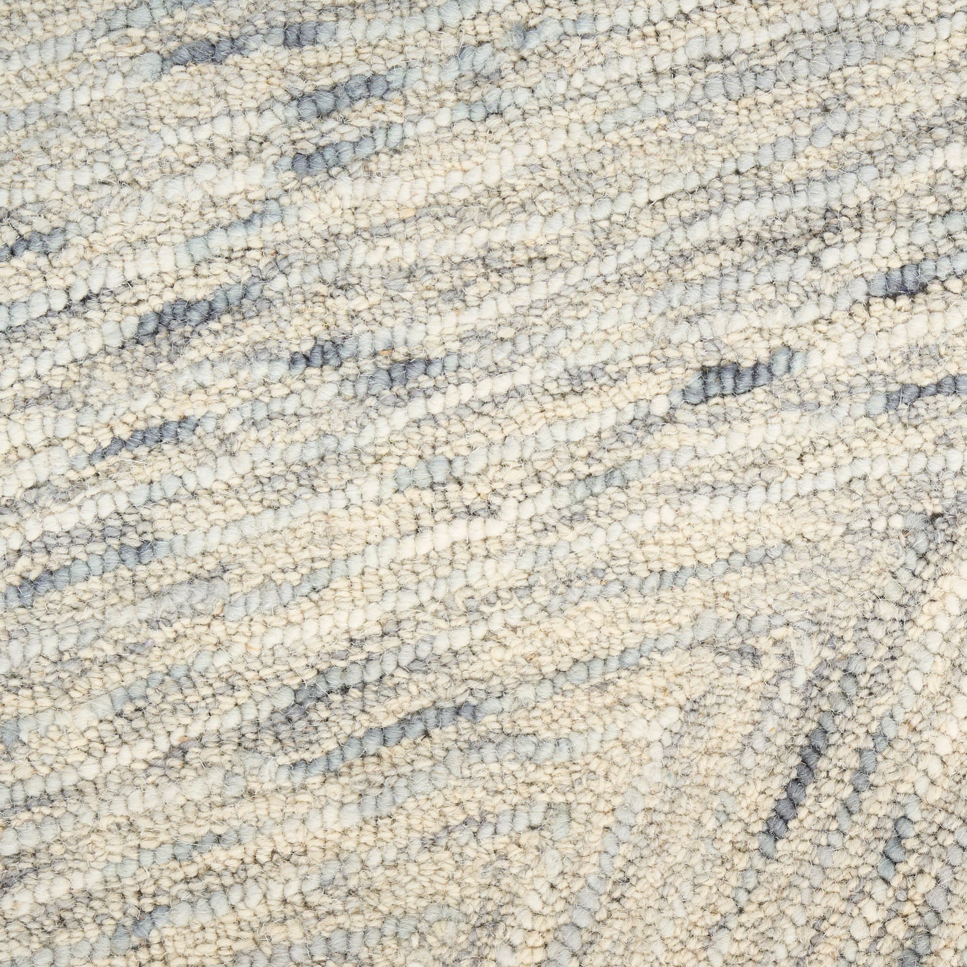 Cream and light blue loop-pile rug with soft, textured surface and subtle diagonal pattern.