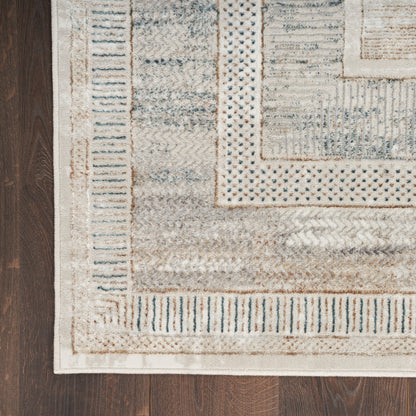 Cream and tan woven 8' runner rug with blue accents and geometric border on dark wood floor.