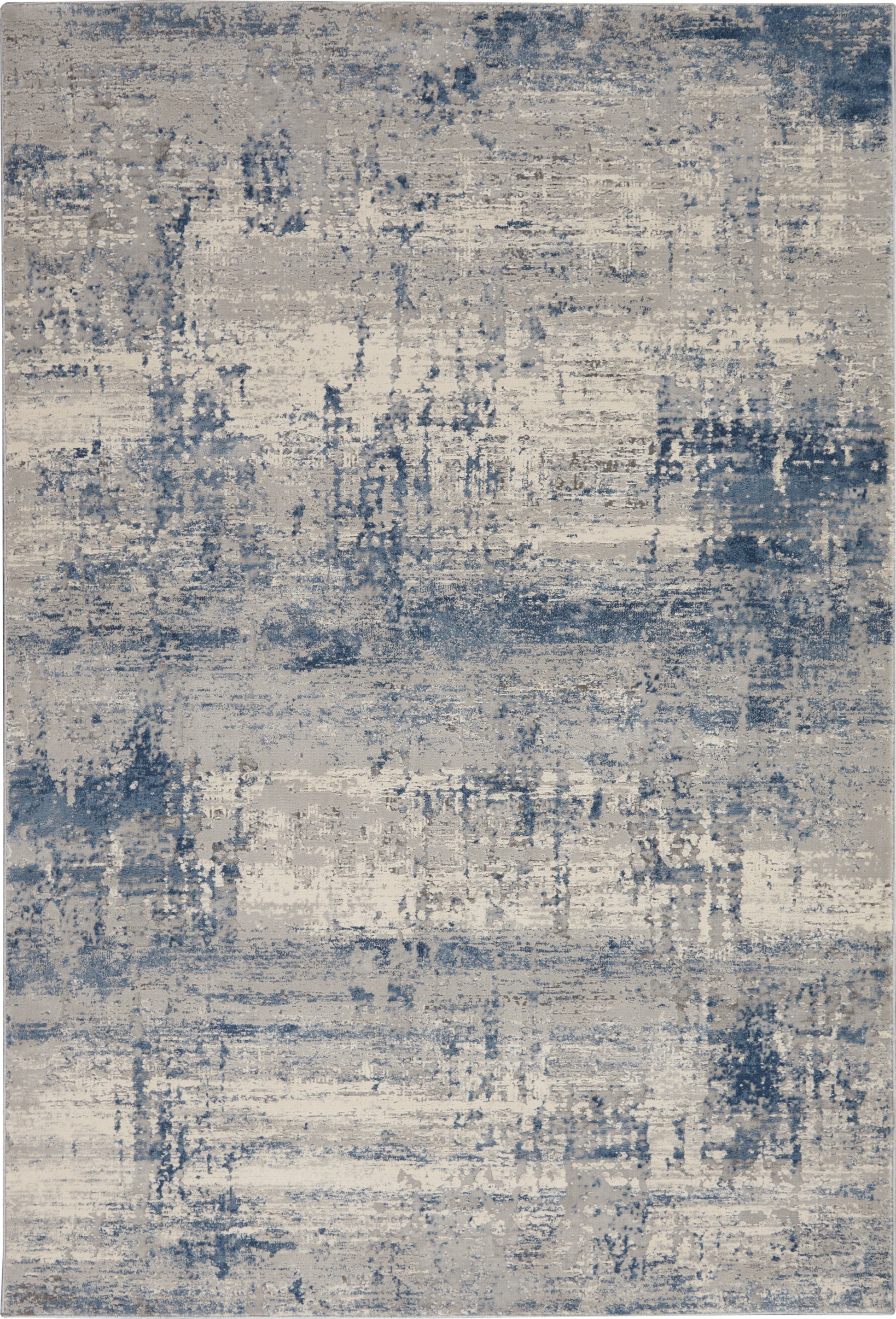 Abstract distressed blue and beige area rug with a washed, modern pattern.