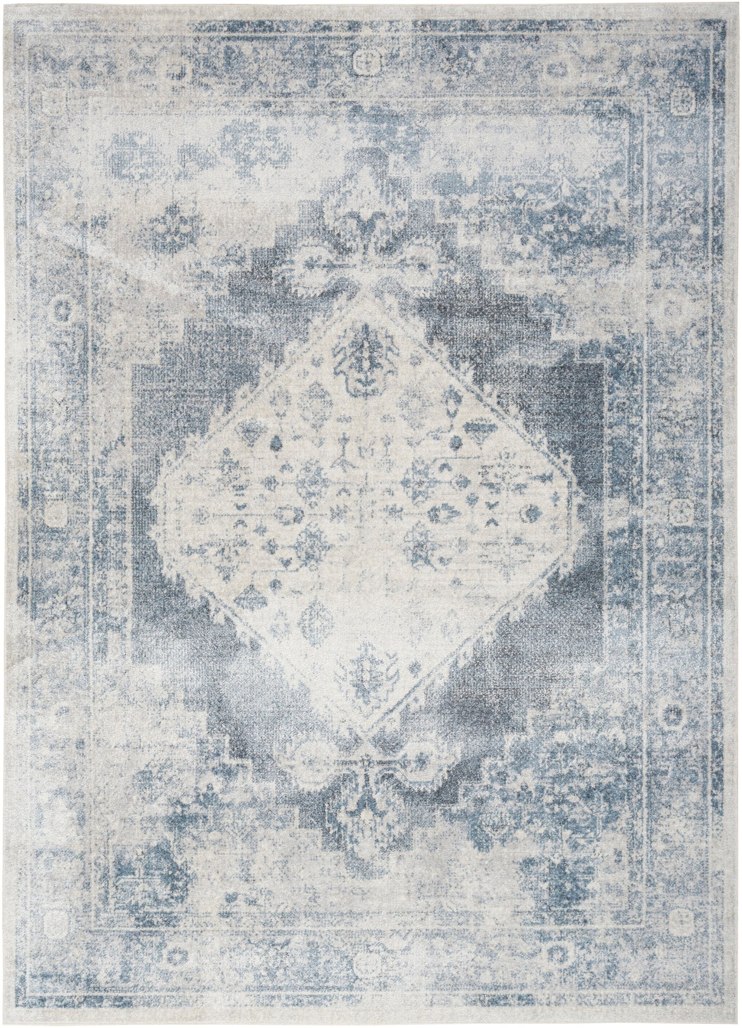 Distressed blue and ivory oriental area rug with a central diamond medallion and ornate border.