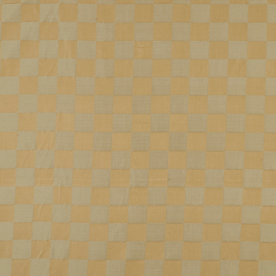 Soft orange and light gray checkerboard fabric pattern; warm squares for tablecloth or upholstery use.