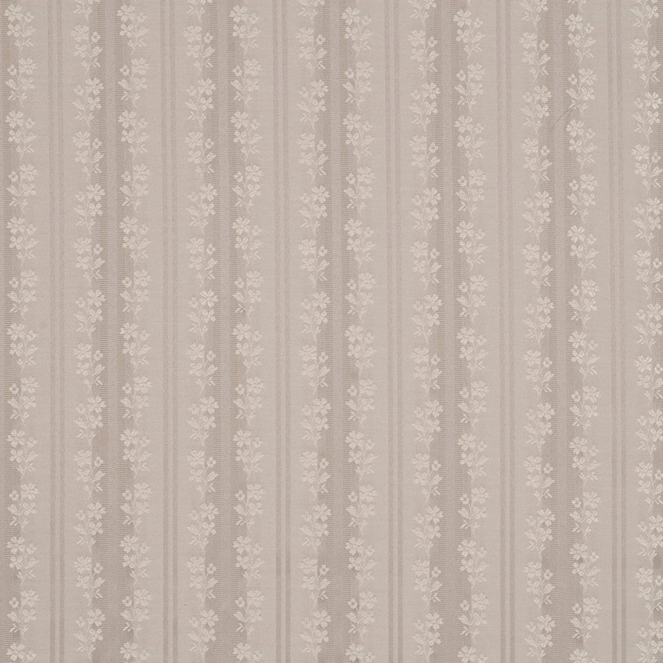 Beige striped wallpaper with delicate white floral motifs.