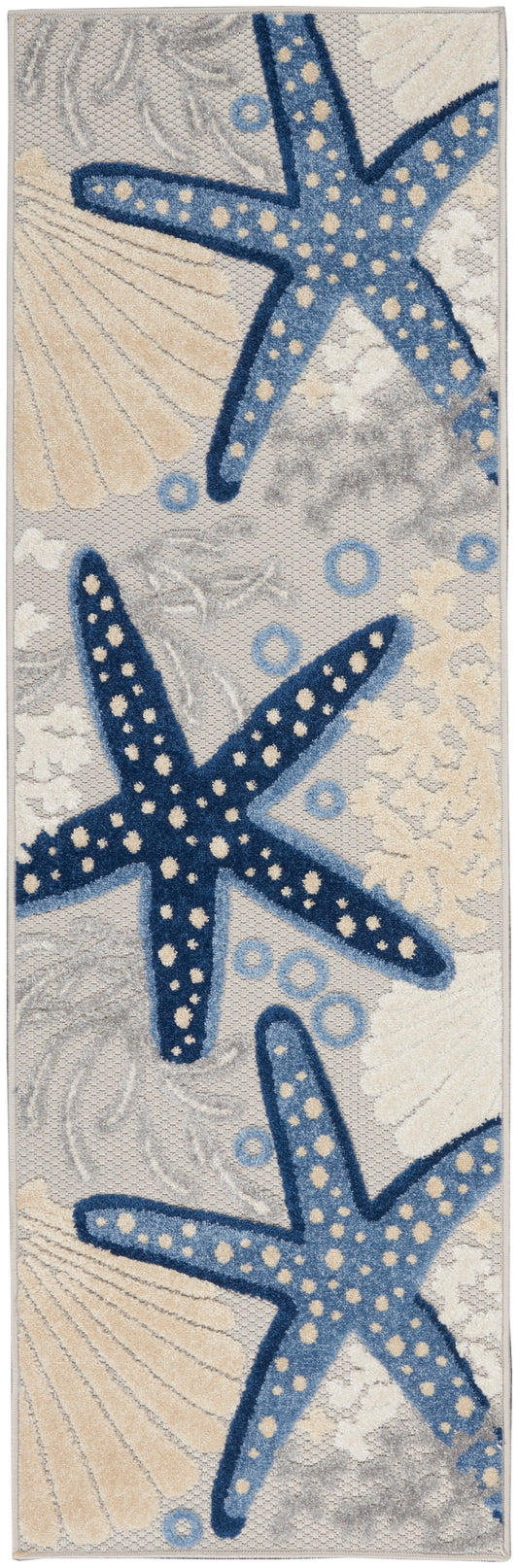 Coastal runner rug with large blue starfish decorated with cream dots, beige seashells and pale gray background.