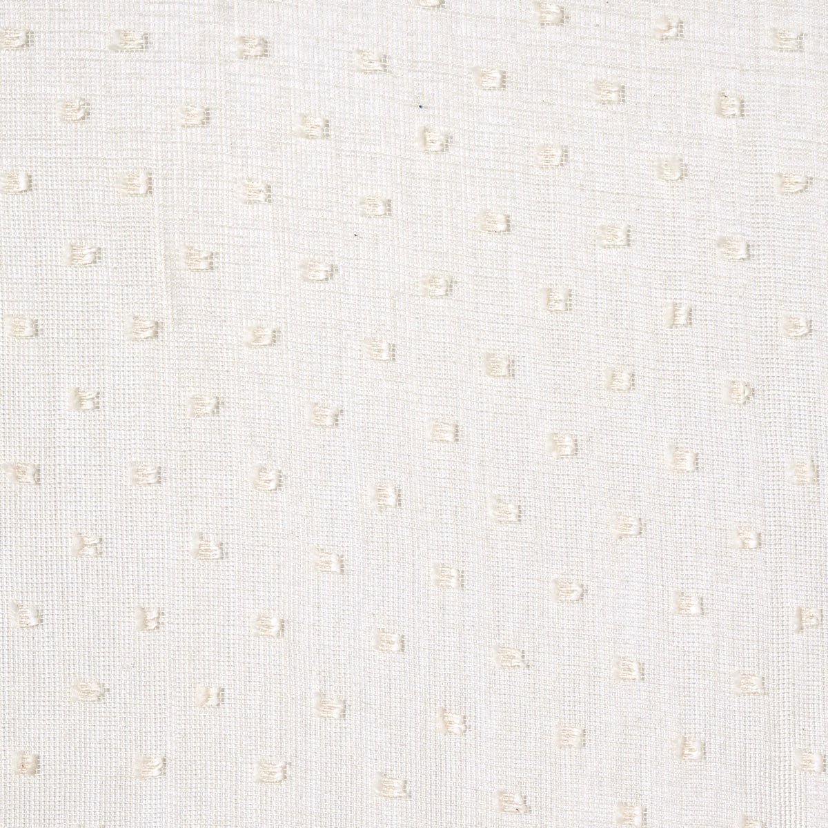 White woven fabric with subtle beige square dots in a dotted Swiss texture.