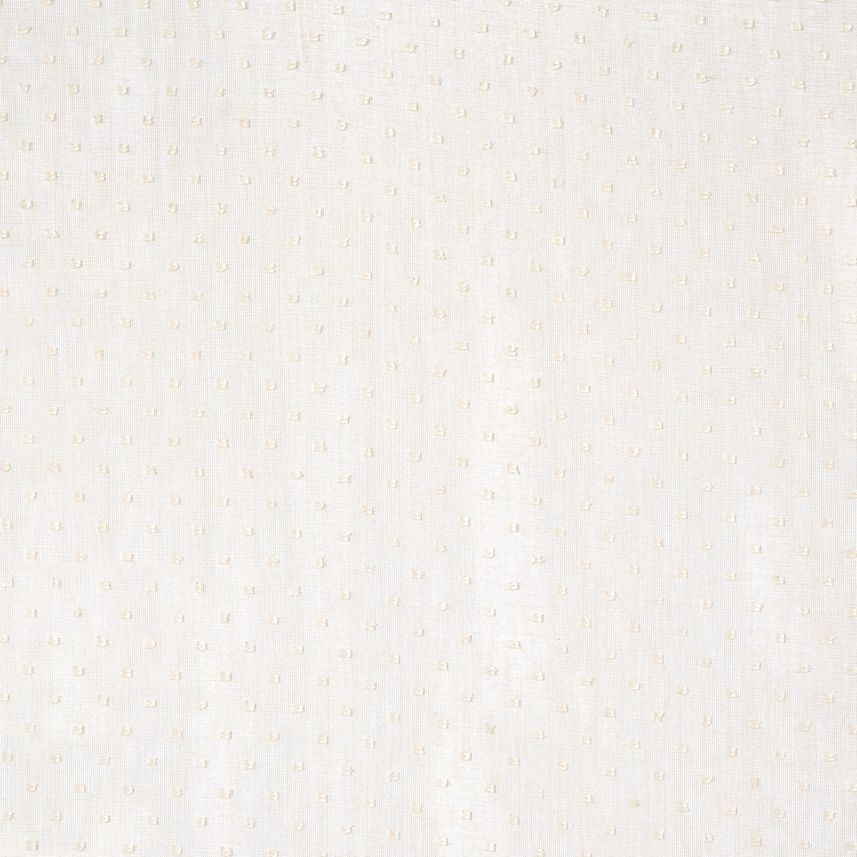 Cream sheer fabric with tiny embroidered dots; close-up.