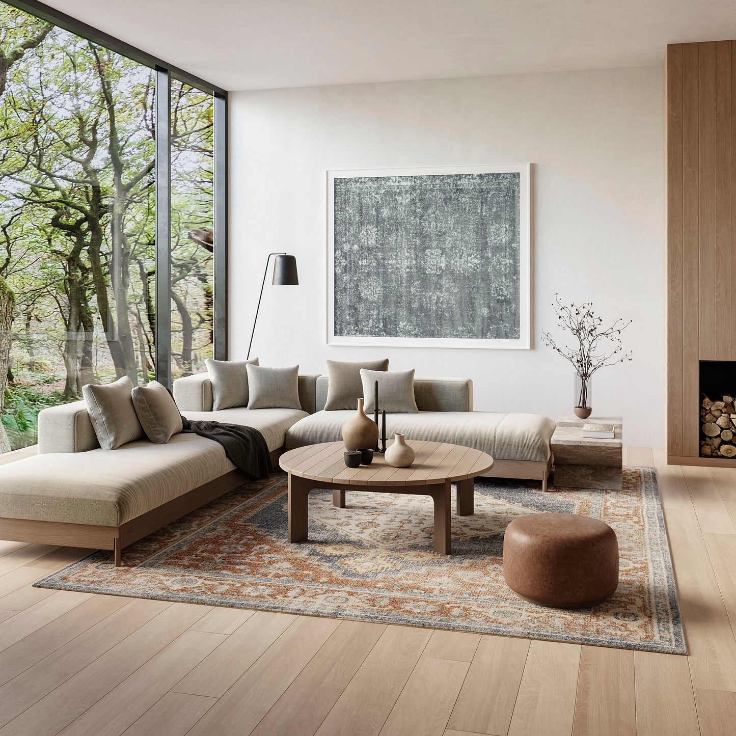 Modern living room with beige rug (9' x 12'), beige sectional, round wooden coffee table, gray textured artwork, floor lamp, and large glass wall.