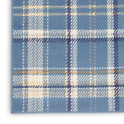 Blue plaid rug with white and gold lines in a tartan pattern; woven textile with bound edge.
