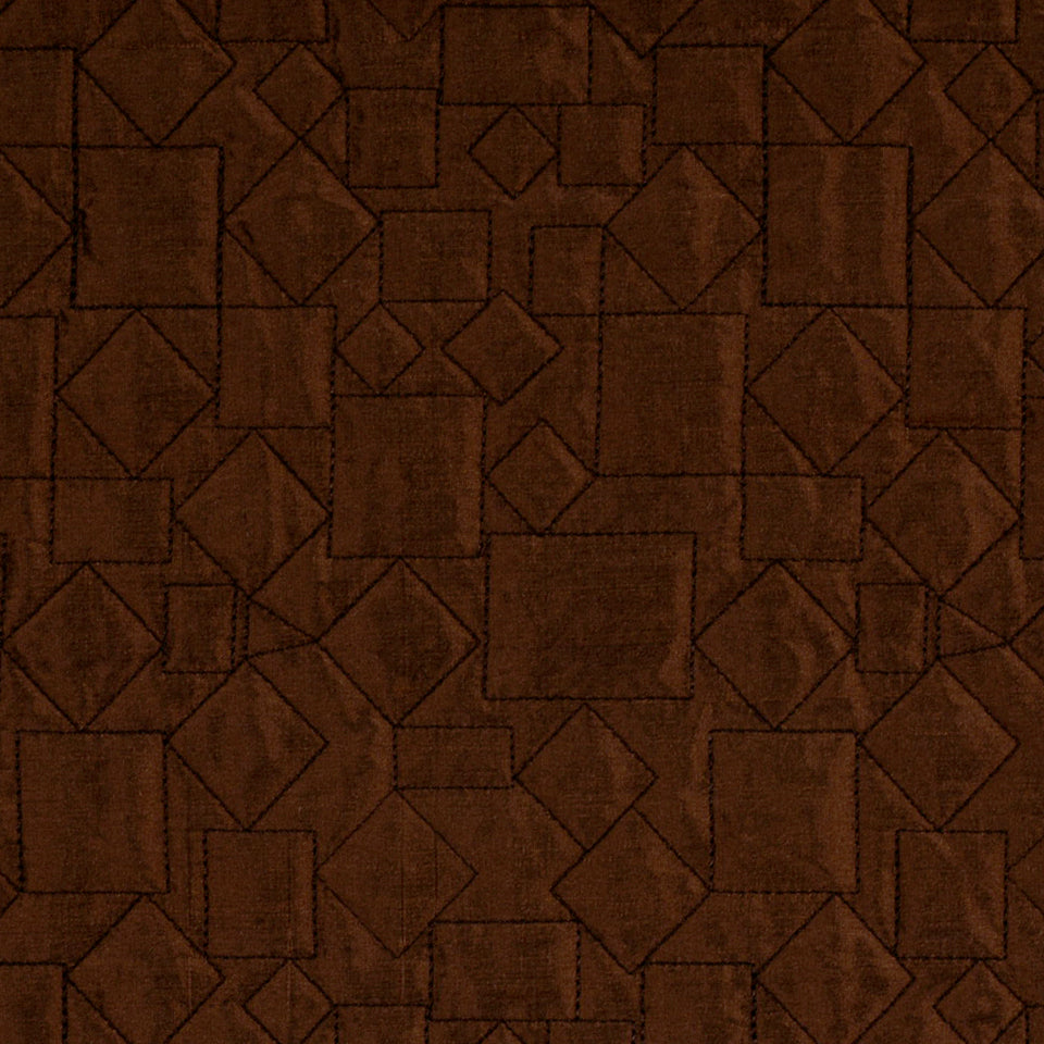 Dark brown quilted fabric with square and diamond patchwork pattern; rustic rug or throw.