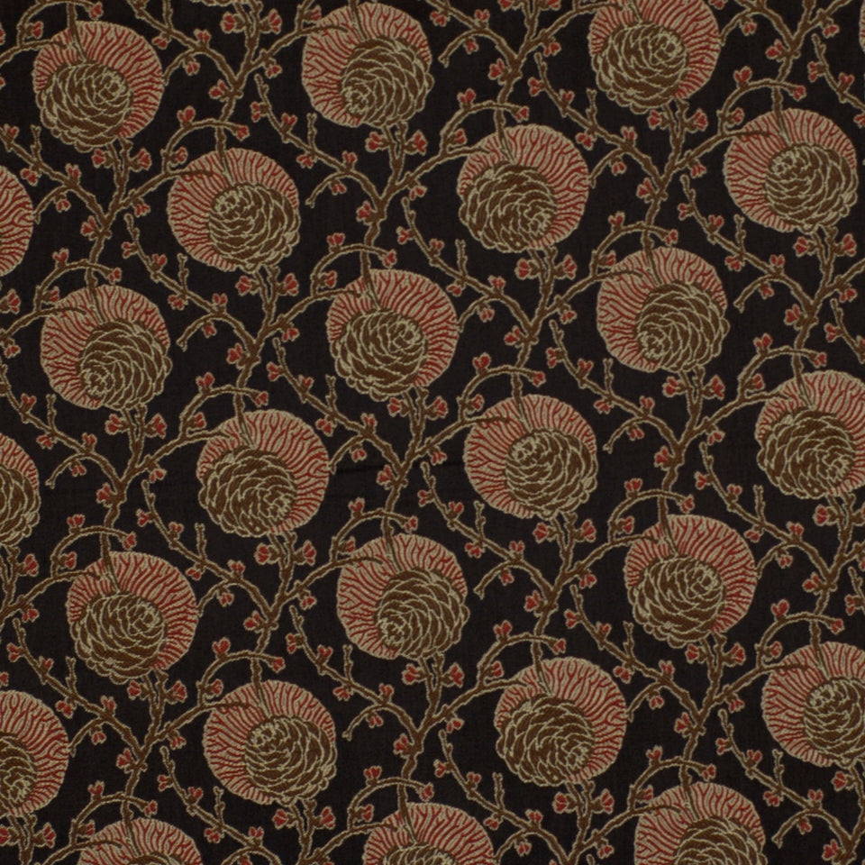 Dark fabric with repeating tan and red spiral floral rosettes connected by twisting vines.