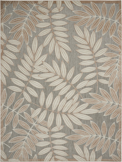 Rectangular woven rug with taupe-gray background and cream-beige botanical leaf pattern.