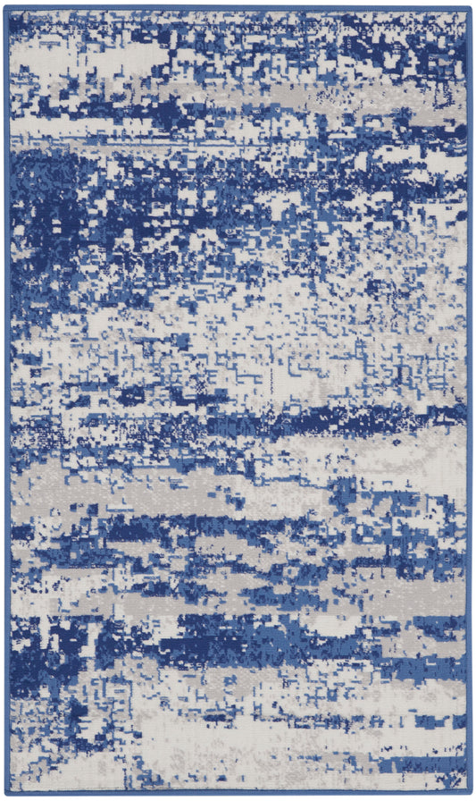 Rectangular blue & ivory abstract area rug with a distressed pattern, modern living room decor.