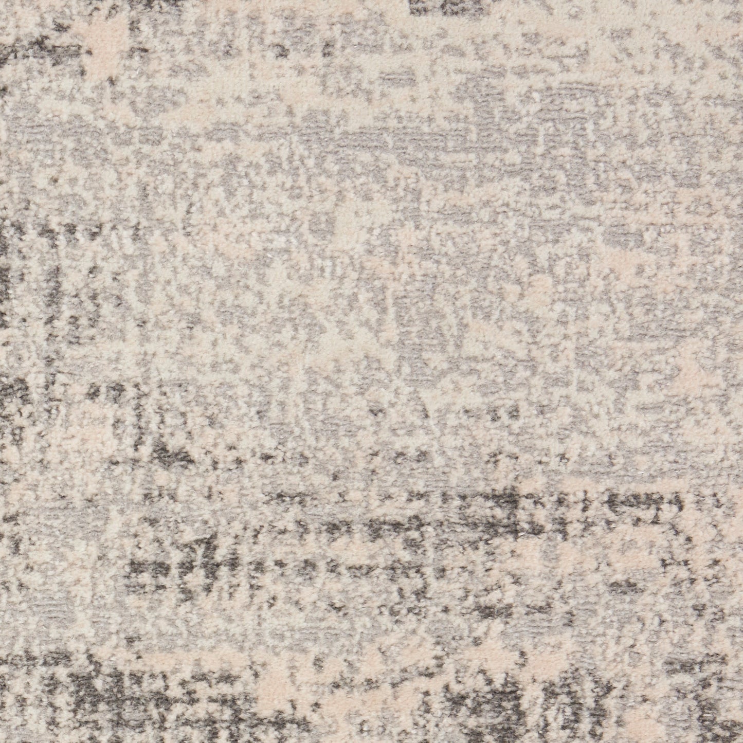 Beige & gray distressed abstract patterned area rug; soft, low-pile textile for living rooms.