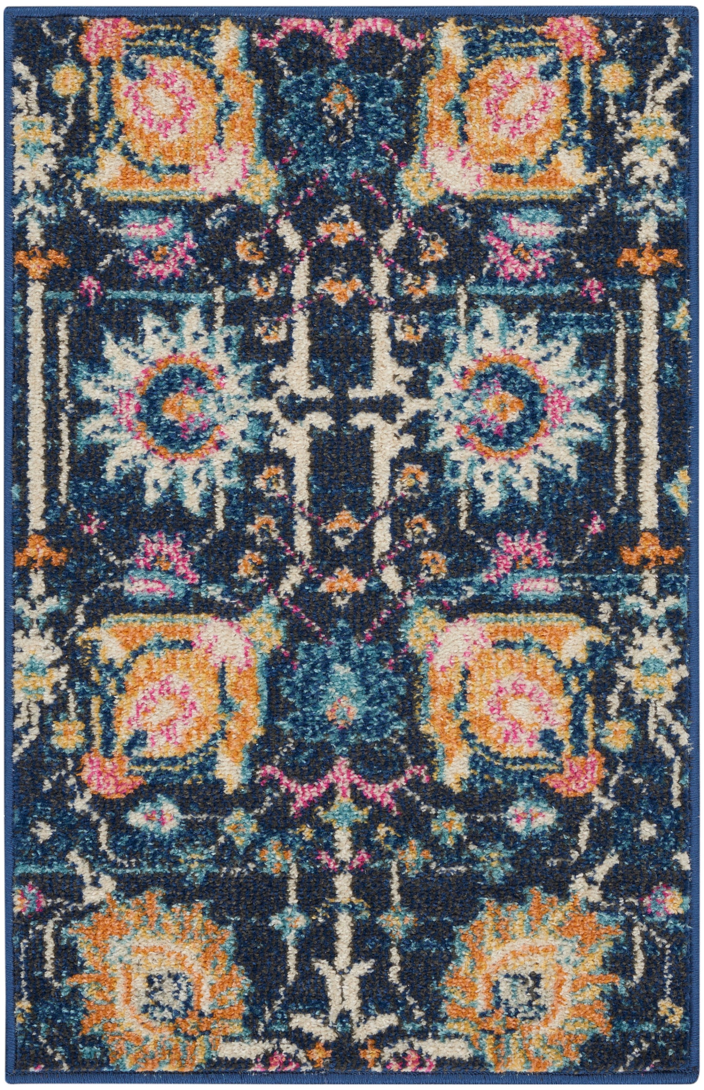 Rectangular oriental rug with dark navy ground, vivid orange, teal, pink florals and cream accents; plush textured pile.