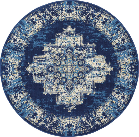 Round oriental rug with navy background, intricate light-blue and ivory central medallion and ornate border.