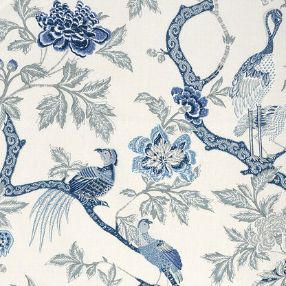 Blue and white chinoiserie wallpaper with peacocks and floral branches on a cream background.