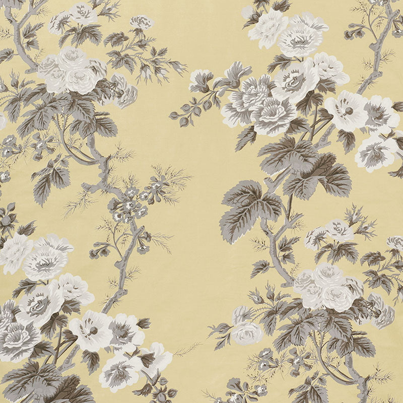 Yellow wallpaper with hollyhock and buttercup floral motifs in a vintage damask pattern.
