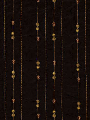 Dark brown fabric with vertical gold beaded strings and evenly spaced round beads in gold and copper tones.