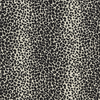 Beige fabric with black leopard print pattern; bold animal-print textile for apparel and accessories.
