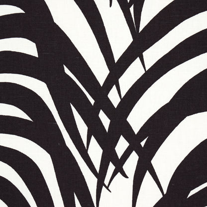 Bold black and white zebra palm print fabric pattern with intersecting lines, abstract textile design.
