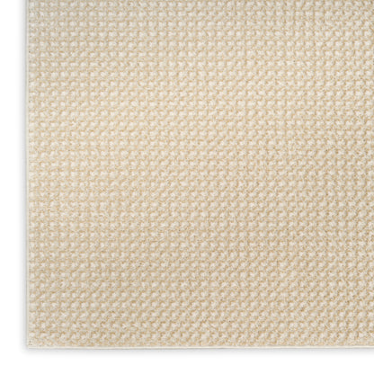 Beige looped woven texture; close-up view of a soft neutral rug sample with tight grid-like pile.
