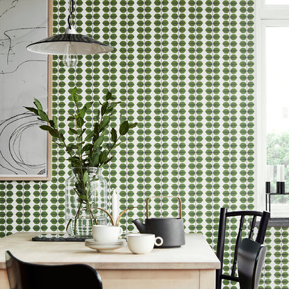 Green leaf-pattern wallpaper.